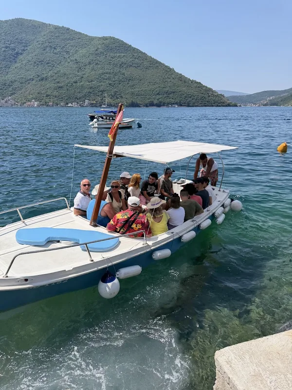 Guests aboard the Family Boat D&S Tours boat in the Bay of Kotor at Perast