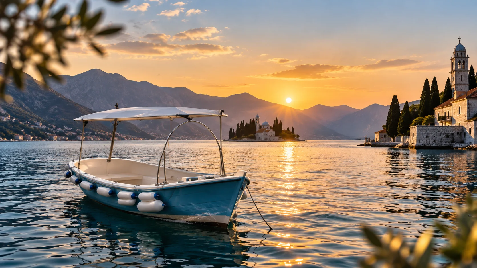 D&S Tours boat at sunset in Perast with Our Lady of the Rocks across the bay